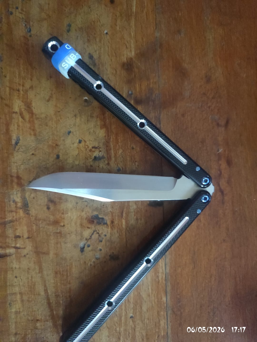 Customer photo review of Blue River Glossy Kraken 7075 Aluminum Handle Titanium Alloy Screws Balisong Stainless Steel Blade Clone Bushing