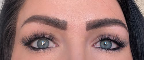 Customer's close-up showing the full, soft Eclipse - Lazy Girl Pre-Glued Lashes on wide-open eyes.