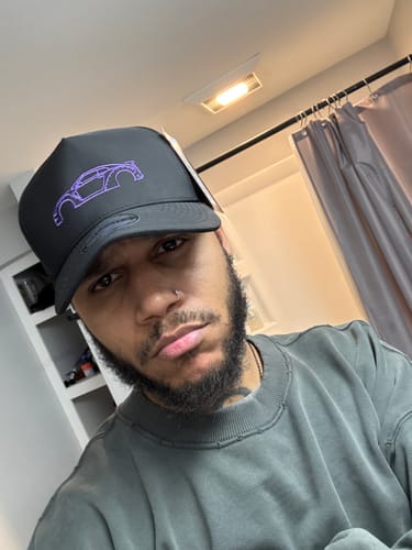 Customer wearing the black 80Eighty® Limited Edition DCG88 Hat with a purple car outline.