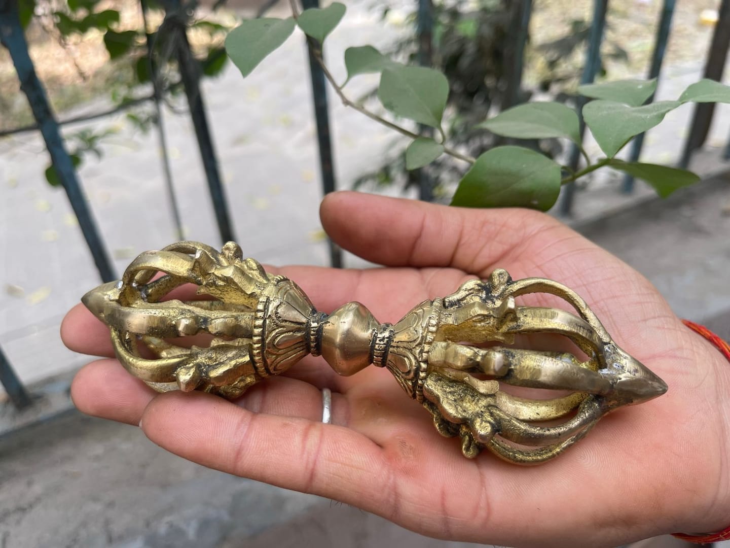 Customer photo review of Brass Vajra Dorje Ritual Tool Vastu Remedy for Protection, Tibetan Meditation and Home Temple Energy 15.7 x 4 cm | 340 gm