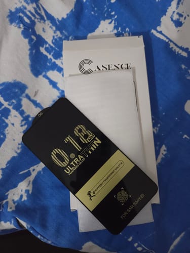 Customer's UltraShield Tempered Glass, showing the "Ultra Thin" label, alongside its packaging.