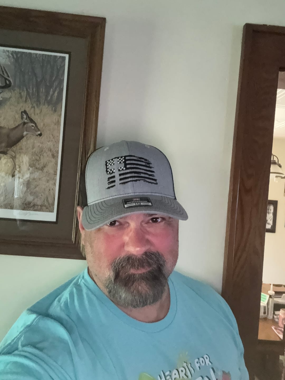 Customer photo review of The Hero Company American Flag Cross Hat - Helps Pair Veterans With A Service Dog or Shelter Dog