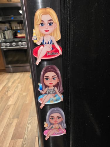 Customer's three personalized 'Girl On Float' cruise magnets with unique names and styles on a refrigerator.