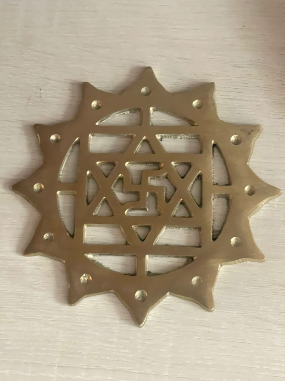 Customer photo review of Brass Swastik with Lotus Helix (Kamal Satya) – Vastu Remedy for Main Door Protection | Evil Eye & Positive Energy Shield | Kitchen/Entrance Placement | 6 x 6 Inch