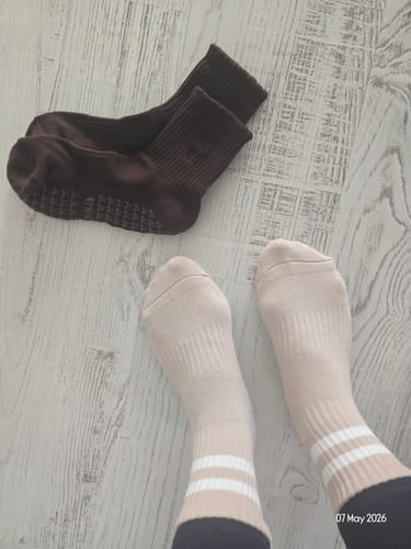 A customer's coffee-colored Dual-Direction Grip Basics socks showing the textured grips on the sole.