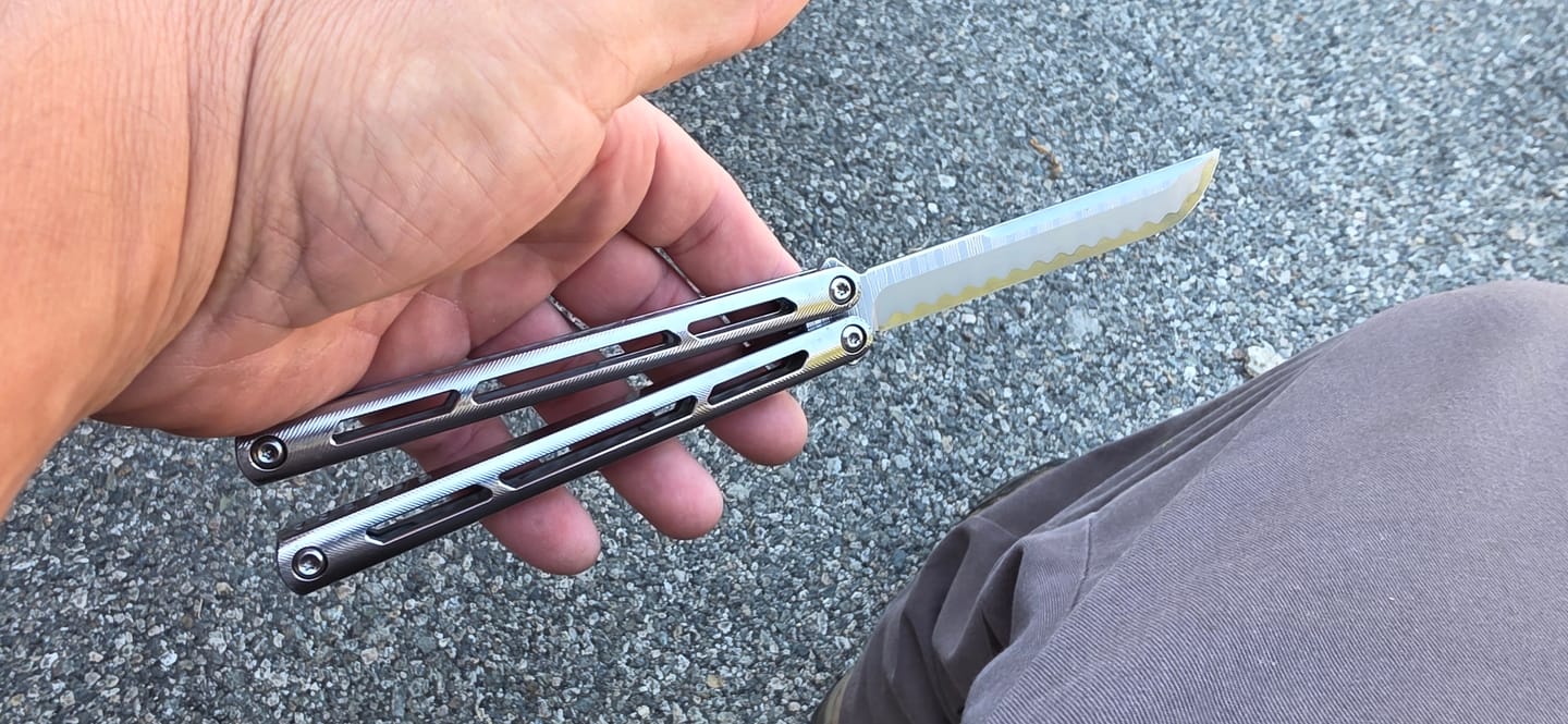 Customer photo review of ARMED SHARK Tsunami Fake Blade Balisong Clone TC4 Titanium alloy handle Damascus stainless steel blade Bushing