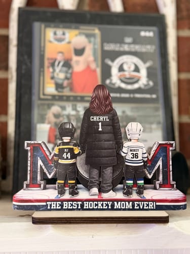 Customer's personalized wooden hockey plaque showing a mom and two kids from behind, with custom names and numbers.