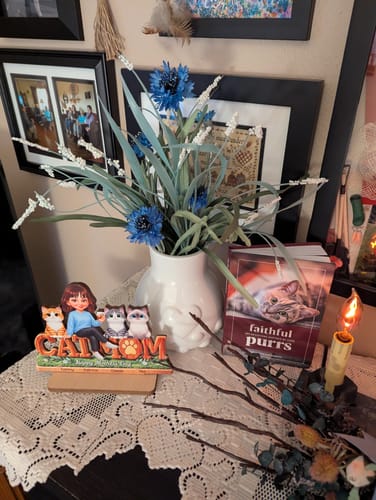 Customer's personalized wooden 'Cat Mom' plaque displayed on a lace-covered table with flowers and other decor.