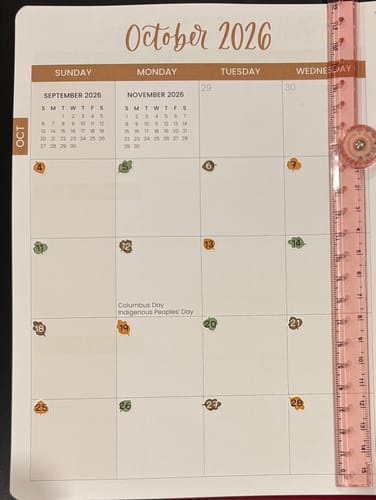 Reviewer's monthly planner showing small Pumpkin Spice Number stickers used to mark the dates for October.