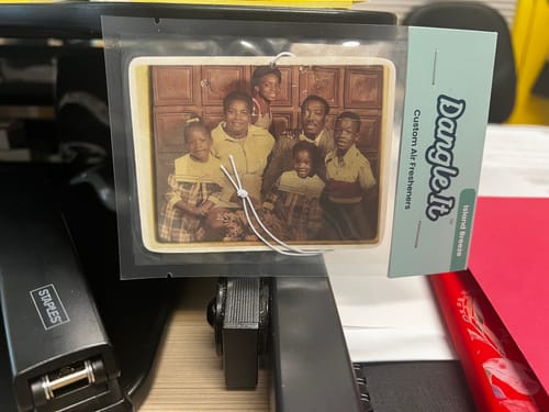 Customer's Custom Air Freshener in its packaging, featuring a vintage-style family photo.