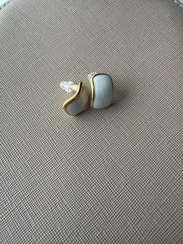 Customer's pair of small Mother Of Pearl Semi Hoop Earrings showing their gold trim and size.