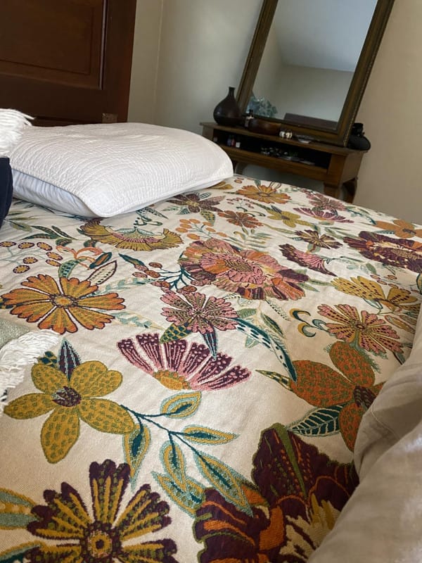 Customer photo review of Boho Floral Cotton Throw – Fringed Tapestry Blanket