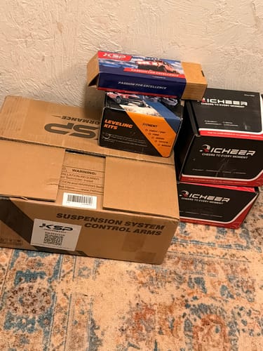 Customer shows the KSP boxes for the Suspension Lift Kits Bundle, including control arms and leveling kits.