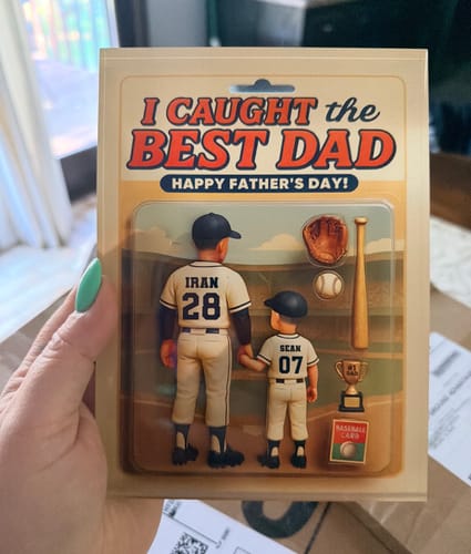 A customer holds the personalized acrylic block plaque showing custom baseball figures of a dad and child from behind.