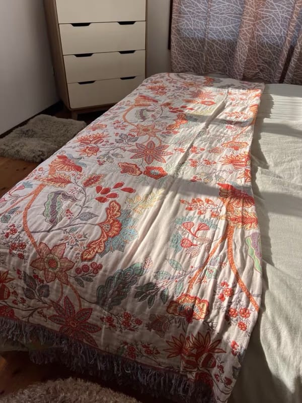 Customer photo review of Boho Floral Cotton Throw – Fringed Tapestry Blanket