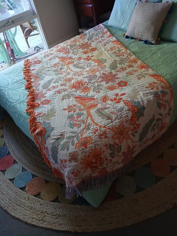 Customer photo review of Boho Floral Cotton Throw – Fringed Tapestry Blanket
