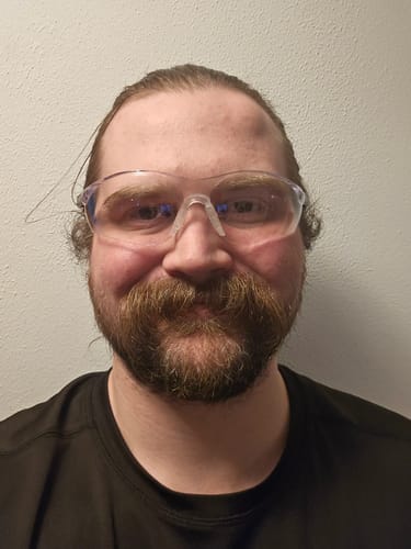Customer wearing the 80Eighty Safety Glasses, showing the clear lenses and fit.