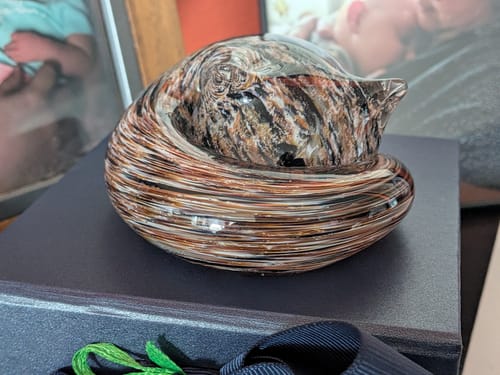 Reviewer's Sleeping Cat with Infused Cremation Ashes in a swirled calico pattern.