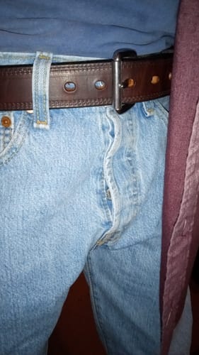 Customer wearing the brown Old World Harness belt with light-wash jeans.