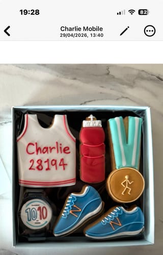 Customer's Running Biscuit Box with a vest biscuit personalized with the name 'Charlie' and a race number.