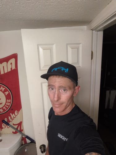 Customer wearing the black 80Eighty Limited Edition DCG89 Shirt and a baseball cap.