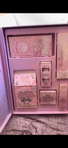 Customer showing the inside of the Dream Under The Moon Set box with all the pink and purple products arranged.