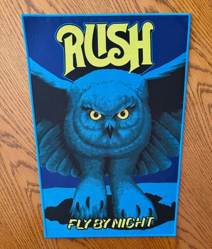 Customer's Rush 'Fly By Night' backpatch laid flat, showing the large blue owl graphic.