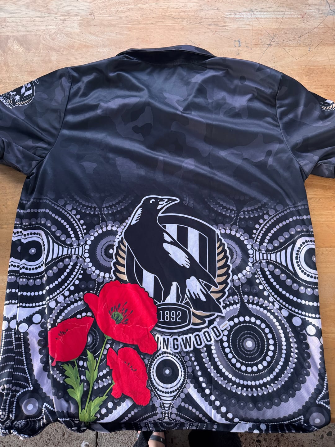 Customer photo review of (Custom Text and Number) Magpies Football ANZAC Day Polo Shirt Aboriginal Poppy Flowers LT13