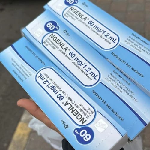 Customer holding three blue and white boxes of Ngenla 60 mg/1.2 mL, showing the received product.