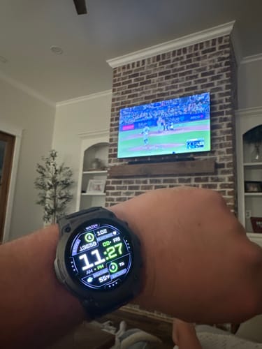 Customer's Gard Pro Ultra 3 watch with its bright digital face showing stats on their wrist indoors.