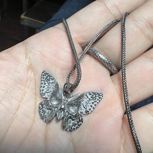 Customer photo review of Butterfly Skull Pendant