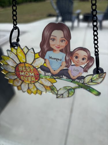 Customer's personalized Sunflower Mom and Kids suncatcher with 'Best Mom Ever' text hanging in a window.