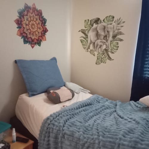 RESTORE neck pillow in a relaxing bedroom