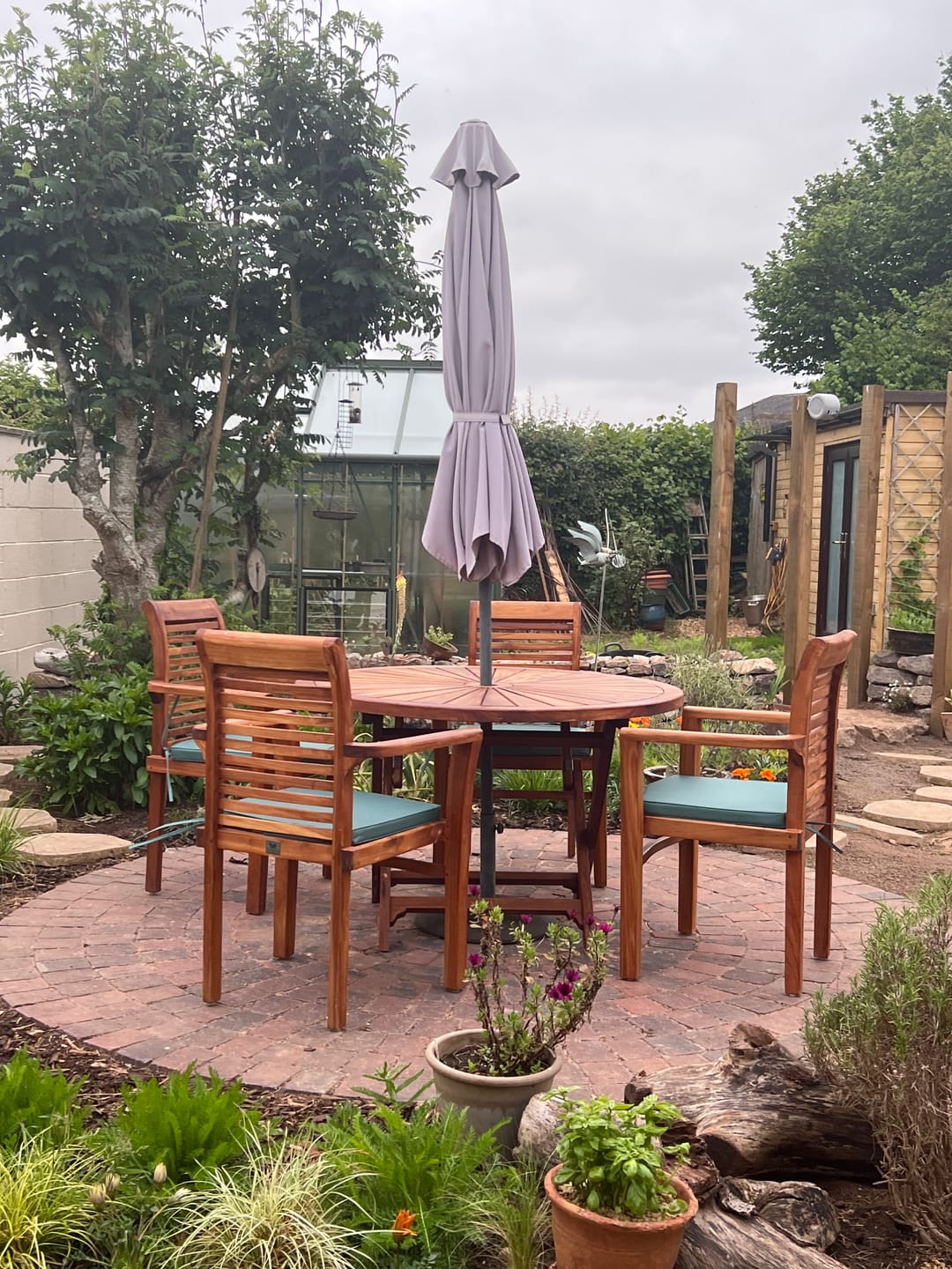 Customer photo review of Teak Garden Furniture Set 120cm Round Sunshine Table 4 x Oxford Stacking Chairs Cushions Included