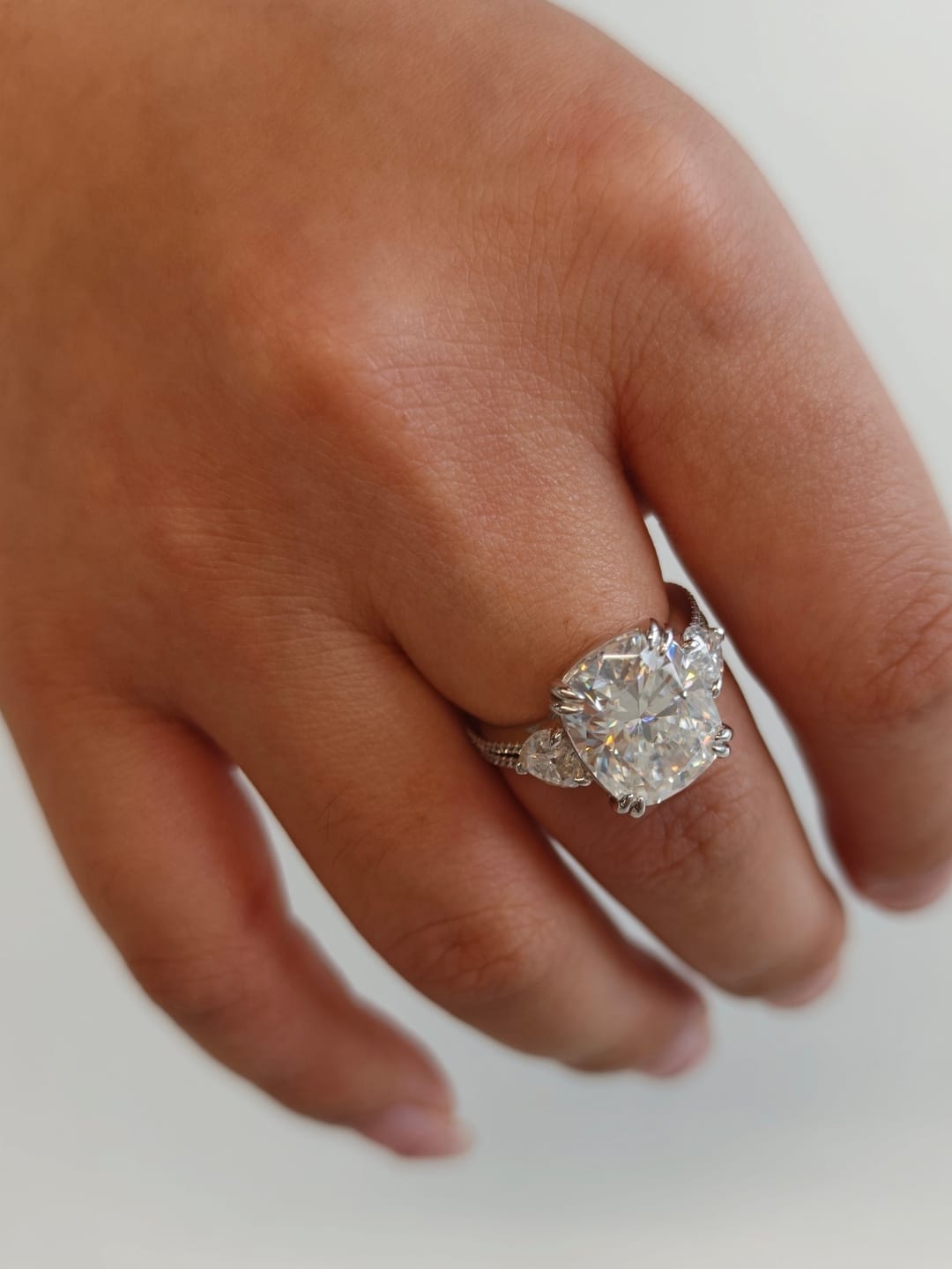 Customer photo review of Moissanite 6.0Ct Cushion Cut Three Stone Engagement Ring In Sterling Silver