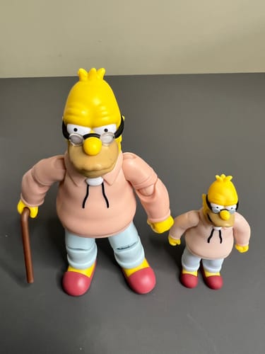 Customer's Grampa Simpson 2.5-inch figure shown next to a larger version of the same character for scale.