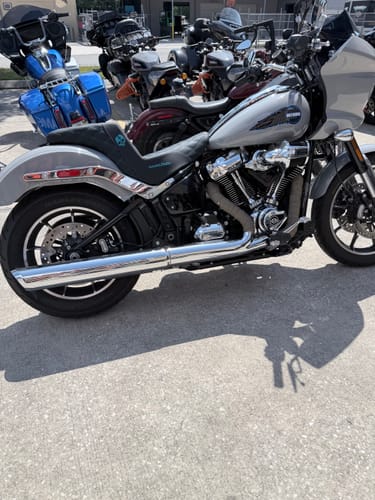 Customer's custom black Born Scum X Saddlemen Step Up Seat with a teal logo installed on a grey motorcycle.