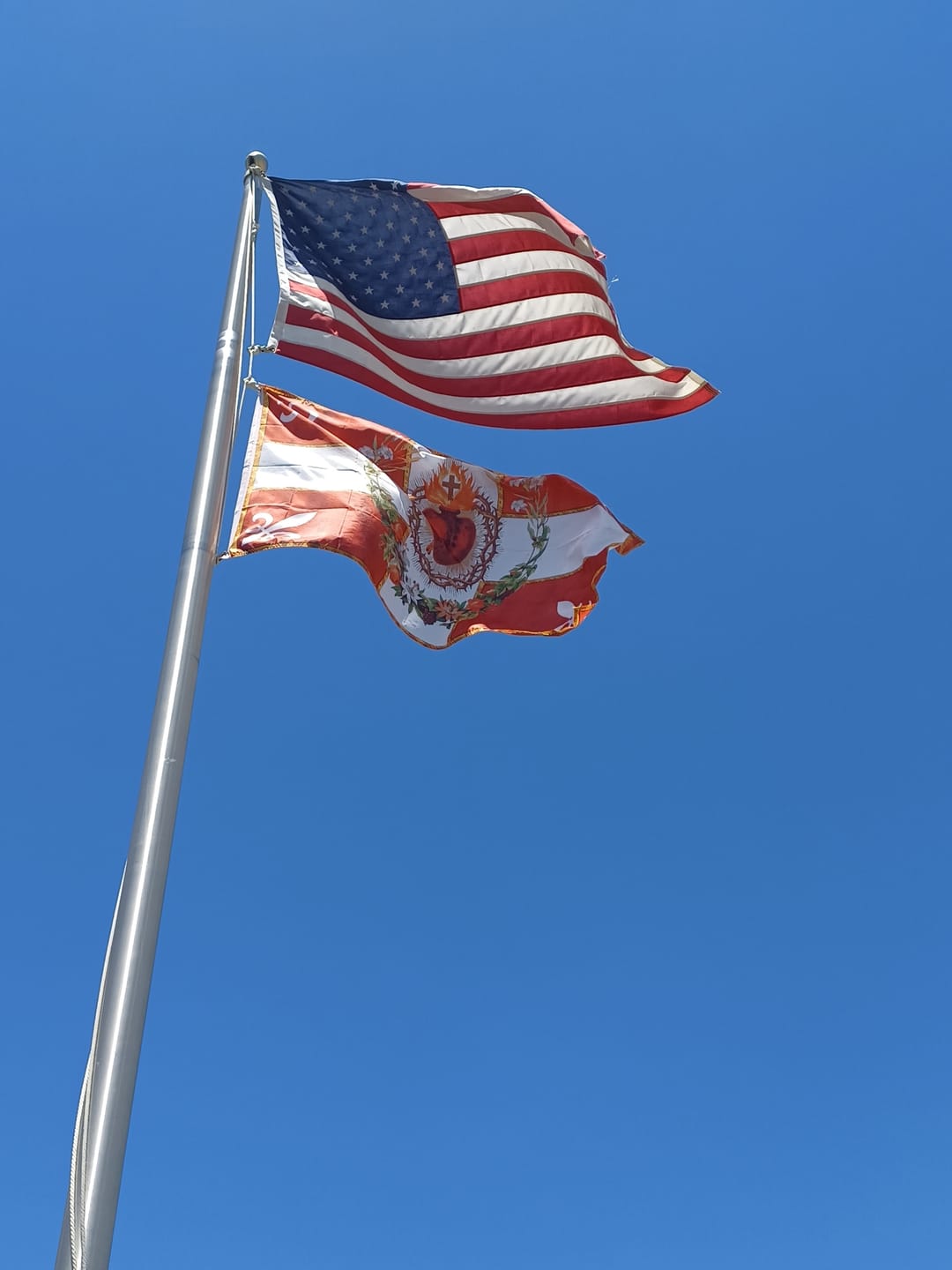 Customer photo review of Flag of the Sacred Heart – Red – Indoor/outdoor Flag – Polyester – 2x3, 3x5 and 4x6.