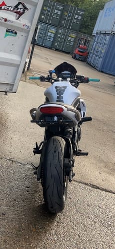 Customer's white Kawasaki ER6N from behind showing the clean look of the installed tail tidy.