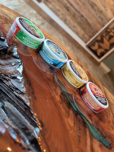Reviewer's lineup of colorful Drifters pouches, with the Watermelon Kiwi Ice flavor in the foreground.