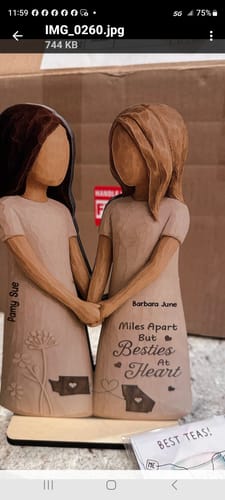 Customer's personalized wooden plaque with two figures holding hands, custom names, and the states of Georgia and Washington.