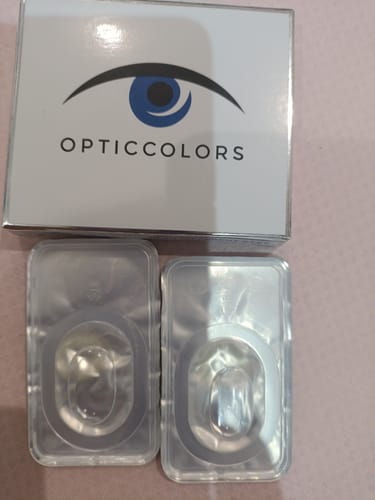 Customer's Opticcolors Crystal lenses in their box and two sealed blister packs.