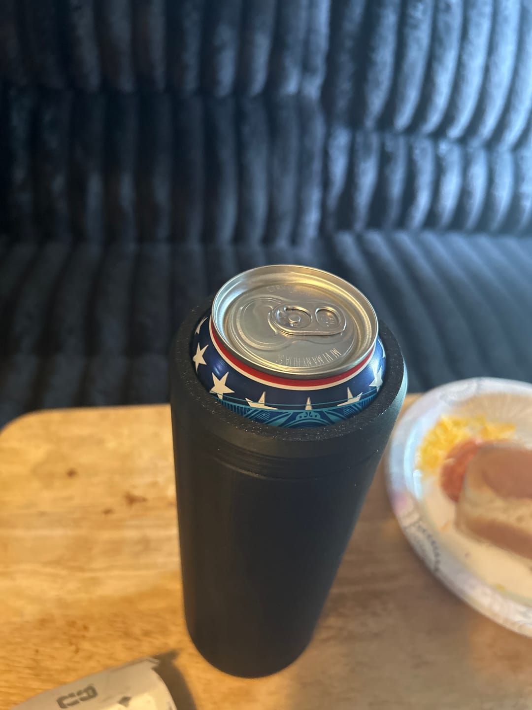 Customer's black Double Tactical Reload Can Holder on a table with a patriotic-themed can inside.
