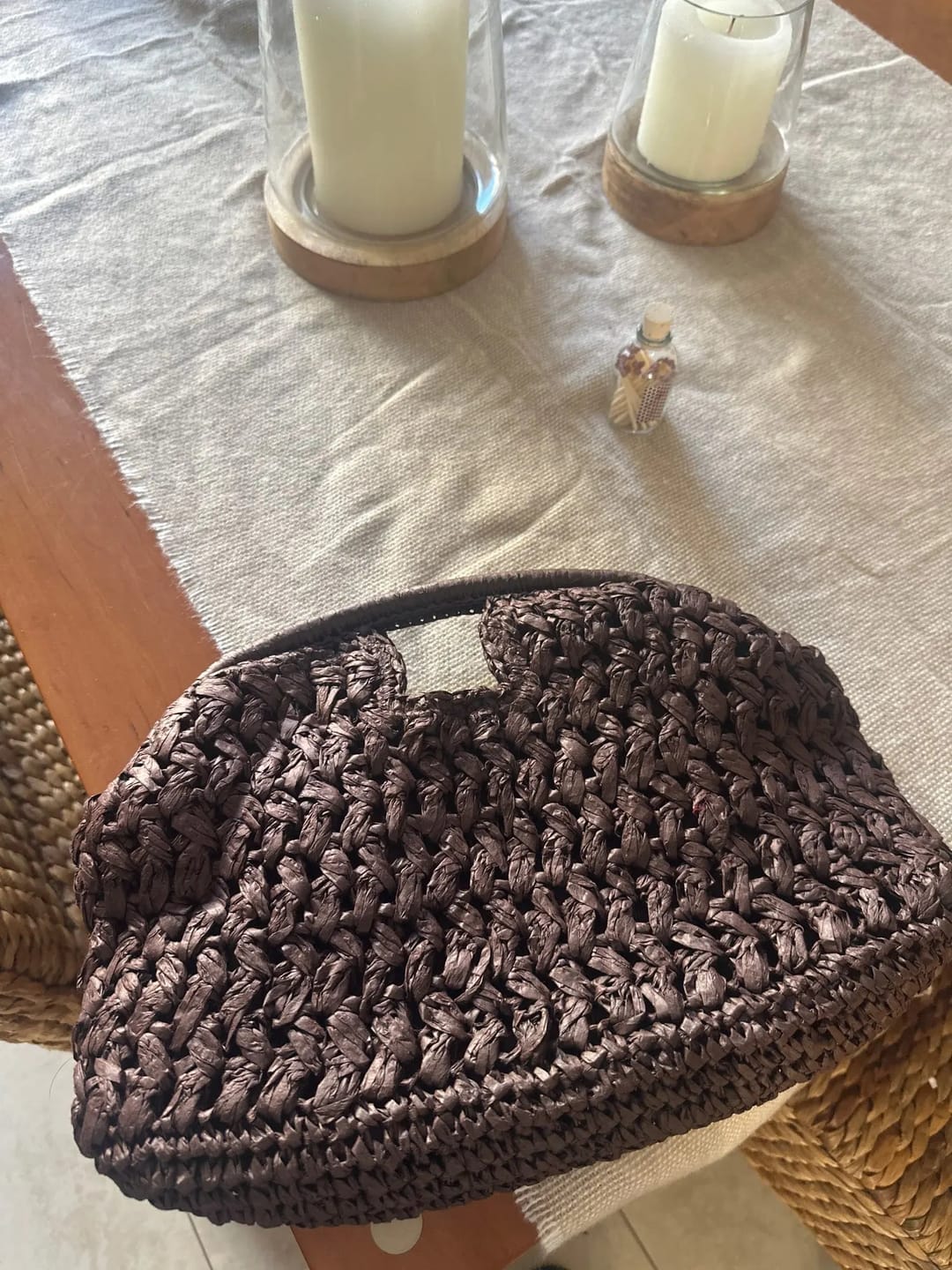 Customer photo review of Raye Woven Straw Shell Clutch