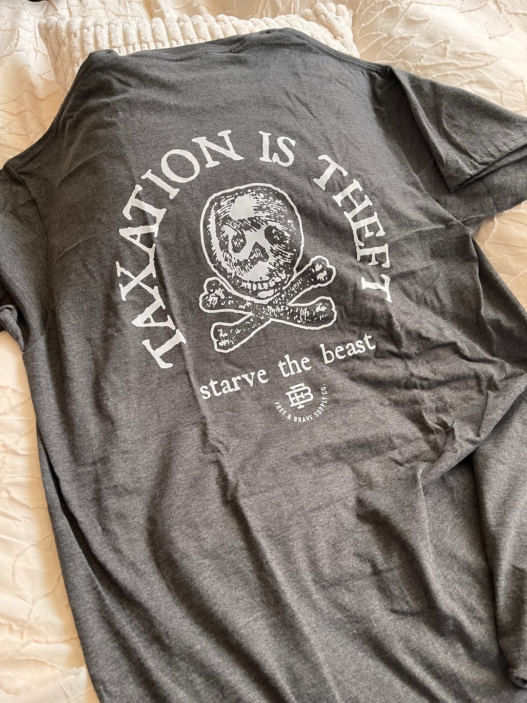 Customer photo review of Taxation is Theft Tee