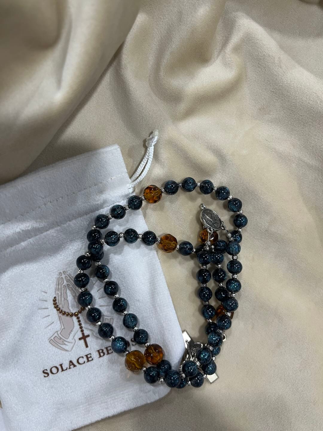 Customer photo review of SolaceBeads Starry Cat Eye & Amber Glass Beads Rosary: Starry Grace - San Nicolas Medal & Crucifix