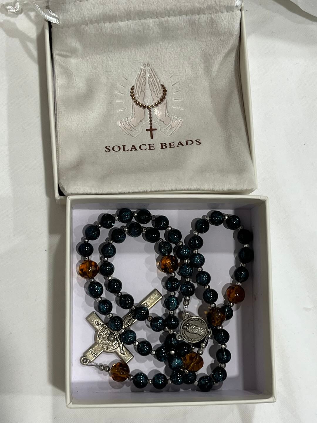 Customer photo review of SolaceBeads Starry Cat Eye & Amber Glass Beads Rosary: Starry Grace - San Nicolas Medal & Crucifix