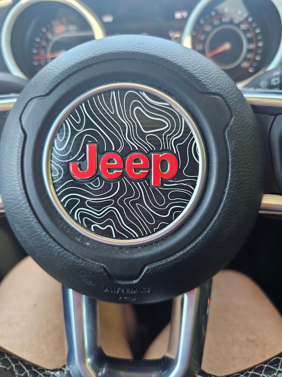 Customer photo review of JEEP Steering Wheel Emblem Overlay Decal — 30+ Colors & Designs (Flag, Topo, Animal, Solid)