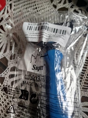 Customer photo review of Double-Sided Dog Dematting Comb & Deshedding Tool for Dogs & Cats
