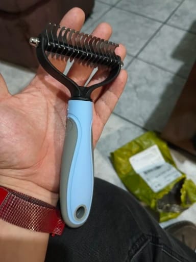Customer photo review of Double-Sided Dog Dematting Comb & Deshedding Tool for Dogs & Cats